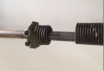 Snapped torsion garage door spring before replacement at Cypress, TX home