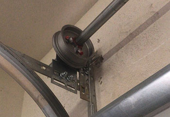 Snapped garage door cable and shifted track before repair in Tomball, TX