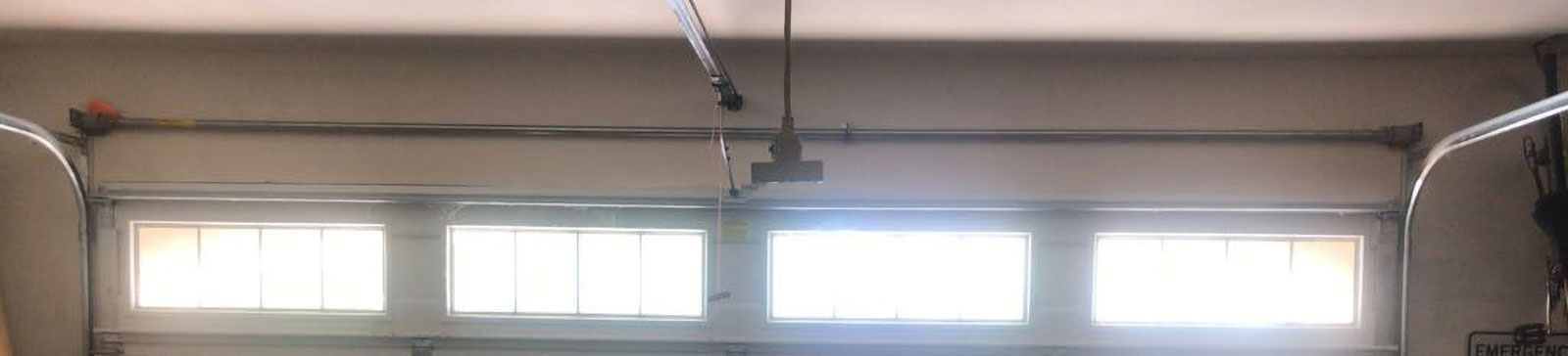 Snapped garage door cable and shifted track before repair in Tomball, TX